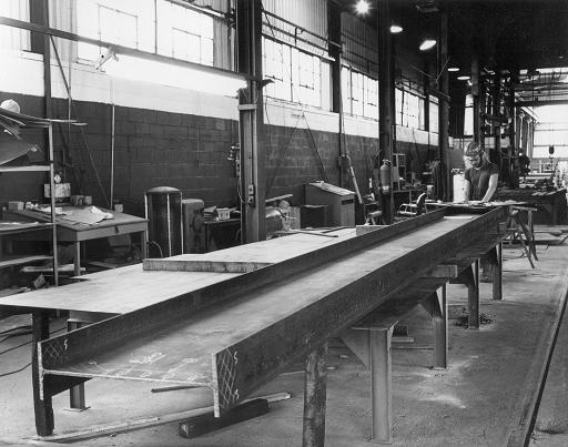old black and white photo of a beam fabrication