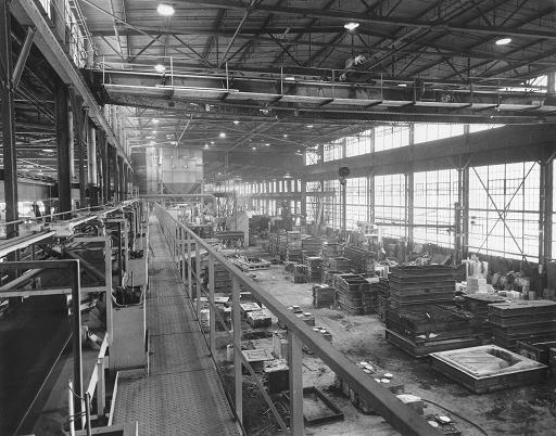 old black and white photo of manufacturing plant interior